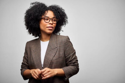 confident african american businesswoman against white background - fashion stock pictures, royalty-free photos & images