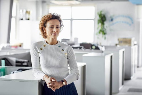 confident businesswoman with hands clasped - fashion stock pictures, royalty-free photos & images