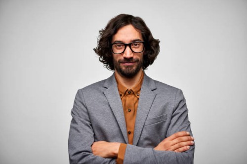 confident male entrepreneur against white background - fashion stock pictures, royalty-free photos & images