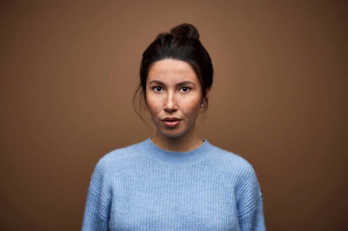 confident mixed race woman against brown background - fashion stock pictures, royalty-free photos & images