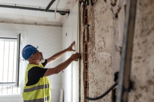 construction worker prepares the kitchen tiles in a home renovation - home decoration stock pictures, royalty-free photos & images