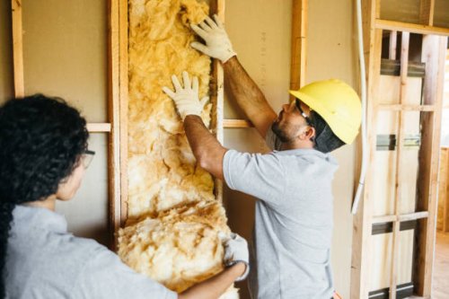 construction workers fitting insulation - home decoration stock pictures, royalty-free photos & images