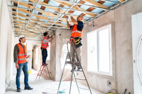 construction workers installing ceiling and windows in renovation - home decoration stock pictures, royalty-free photos & images