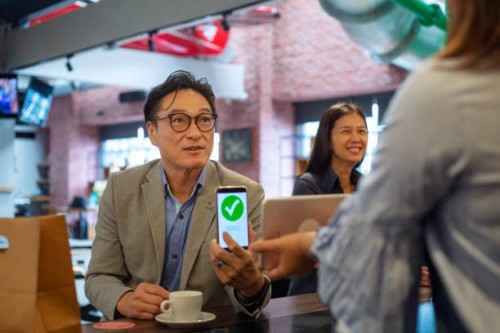 contactless payment in a coffee shop - junk food stock pictures, royalty-free photos & images