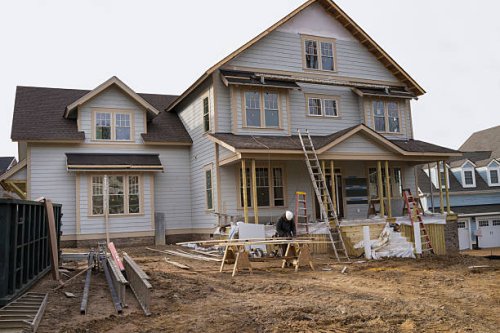 contractor working on house at construction site - home decoration stock pictures, royalty-free photos & images