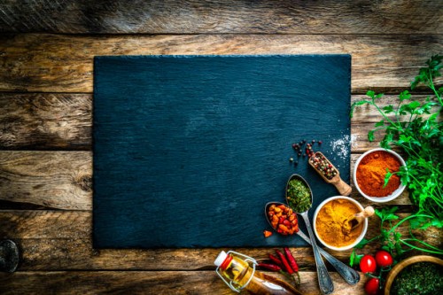 cooking background: multi colored spices, herbs and vegetables on rustic wooden table. copy space - food stock pictures, royalty-free photos & images