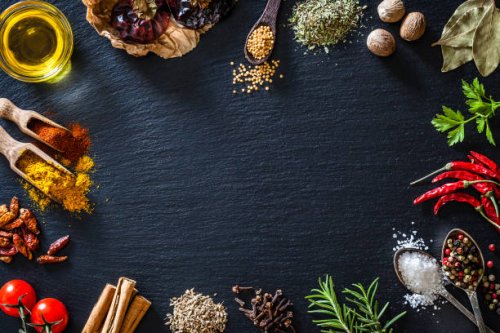 cooking nd seasoning spices border on black slate background - food stock pictures, royalty-free photos & images