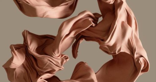 cotton fabrick flowing by wind on beige background stock photo - fashion stock pictures, royalty-free photos & images