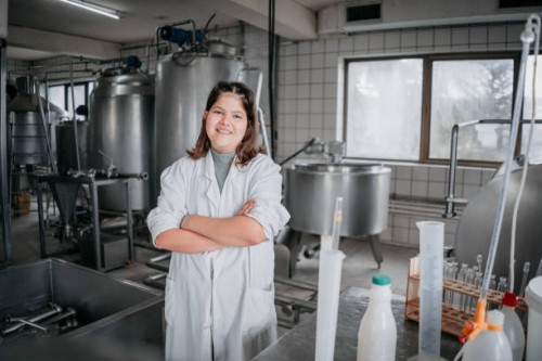 couple bottling milk on manufacture - food stock pictures, royalty-free photos & images