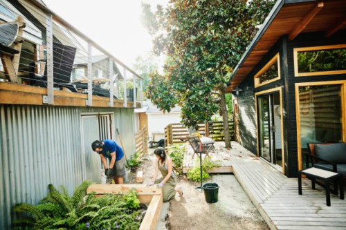 couple building garden beds in backyard on summer afternoon - home decoration stock pictures, royalty-free photos & images