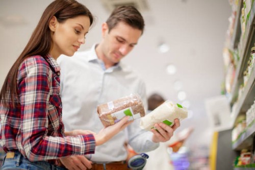 couple choosing between wholegrain and refined rice - food stock pictures, royalty-free photos & images