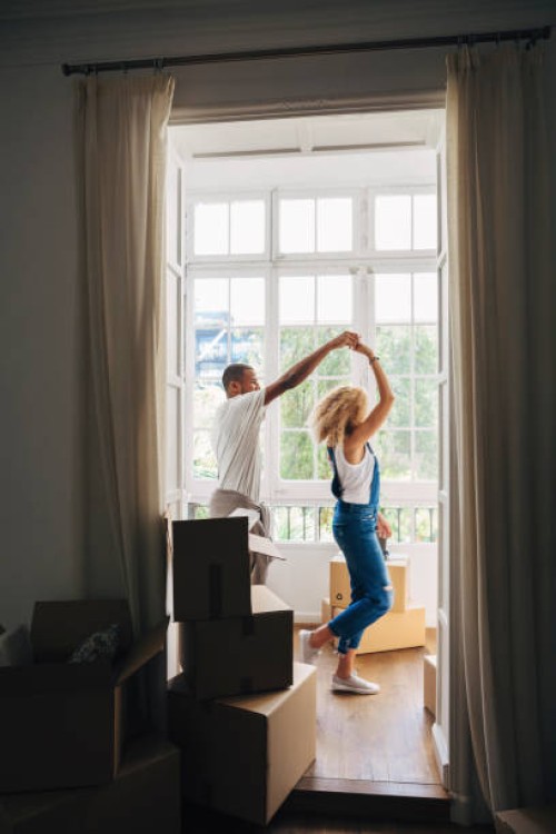 couple dancing in new house seen through doorway - home decoration stock pictures, royalty-free photos & images