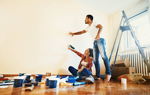 couple decoration their apartment. - home decoration stockfoto's en -beelden