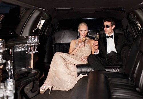 couple drinking champagne in limo - fashion stock pictures, royalty-free photos & images
