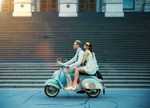 couple driving vintage scooter - fashion photos et images de collection