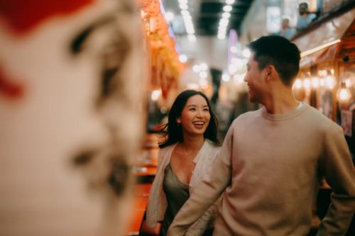 couple having fun in tokyo at night - travel stock pictures, royalty-free photos & images