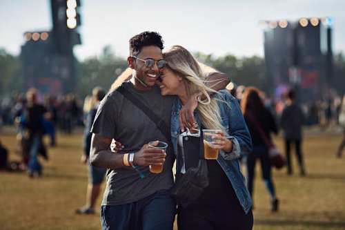couple laughing together at concert - concert stock pictures, royalty-free photos & images