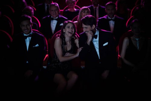 couple laughing while enjoying opera amidst crowd - concert stock pictures, royalty-free photos & images