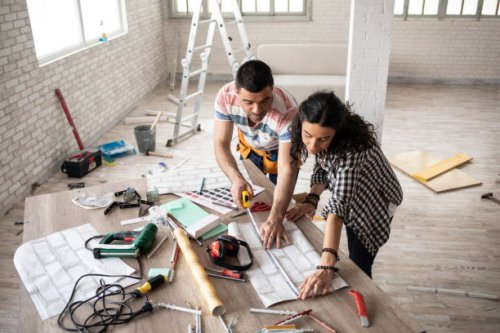 couple making home improvement and measuring - home decoration stock pictures, royalty-free photos & images