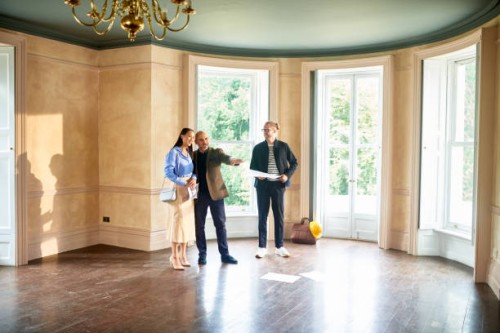 couple meeting with architect in new house - home decoration stock pictures, royalty-free photos & images