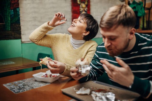 couple on lunch together - junk food stock pictures, royalty-free photos & images