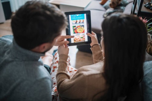 couple ordering food online at home. - food stock pictures, royalty-free photos & images