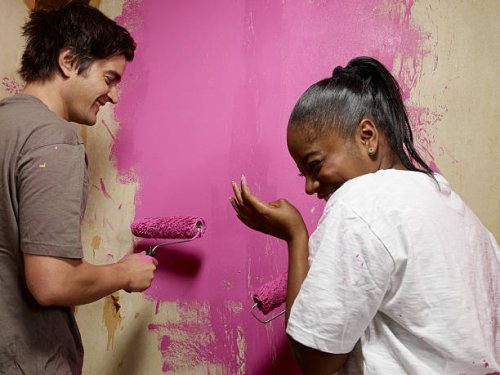 couple painting, laughing - home decoration stock pictures, royalty-free photos & images