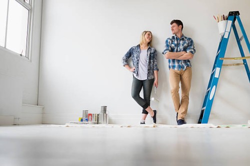 couple painting room white - home decoration stock pictures, royalty-free photos & images