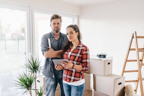 couple planning their new home, using virtual reality goggles - home decoration stock pictures, royalty-free photos & images