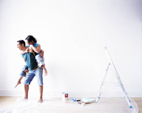 couple playing while painting room - home decoration stock pictures, royalty-free photos & images