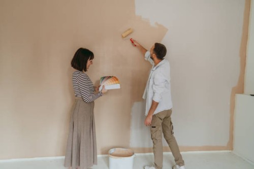 couple renovating and choosing paint colors for their home - home decoration stock pictures, royalty-free photos & images