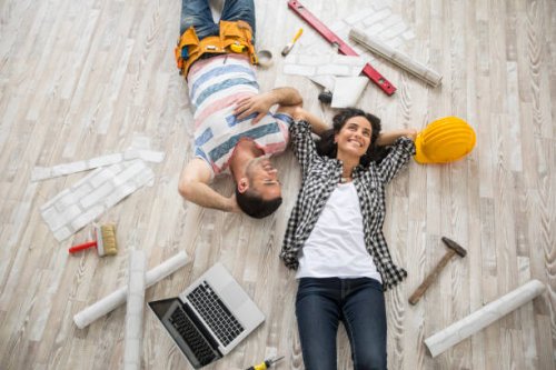 couple renovating and resting on floor - home decoration stock pictures, royalty-free photos & images
