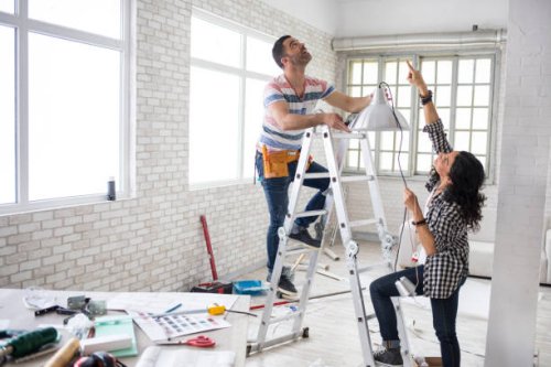 couple renovating their apartment - home decoration stock pictures, royalty-free photos & images