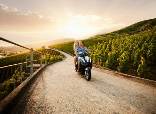 couple riding scooter in vineyard - travel stock pictures, royalty-free photos & images
