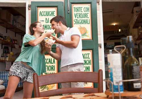 couple sharing food at cafe - food stockfoto's en -beelden