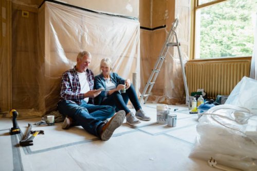couple sitting relaxing - home decoration stock pictures, royalty-free photos & images