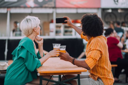 couple taking a selfie - concert stock pictures, royalty-free photos & images