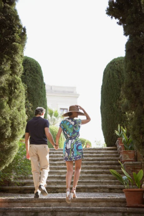 couple walking up outdoor staircase - fashion stock pictures, royalty-free photos & images
