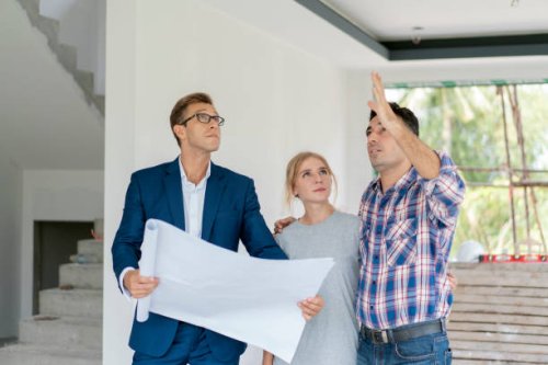 couple with real estate agent visiting property for viewing - home decoration stock pictures, royalty-free photos & images