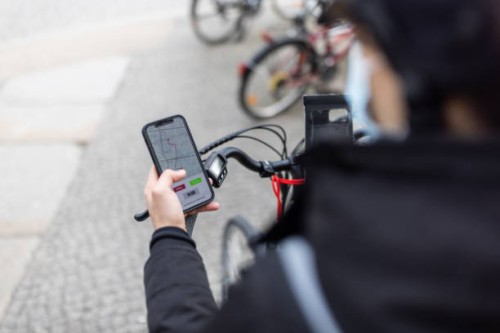 courier person looking at directions on smartphone - junk food stock pictures, royalty-free photos & images