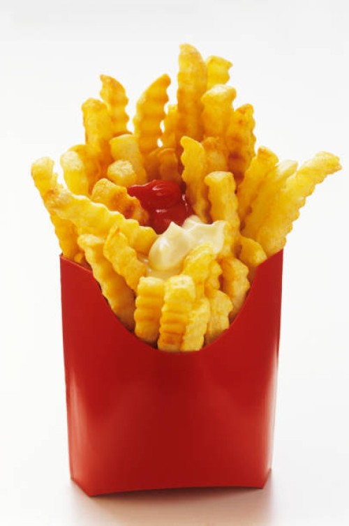 crinkle cut french fries in red box with ketchup and mayonnaise - junk food stock pictures, royalty-free photos & images
