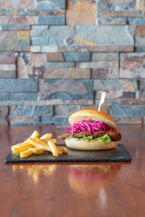 crispy chicken burger with french fries on a terrace table - junk food stock pictures, royalty-free photos & images
