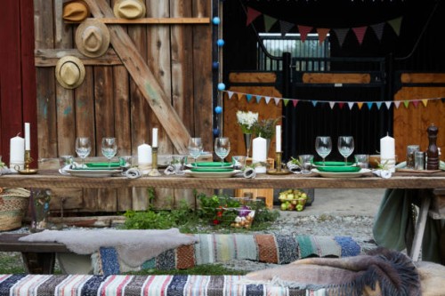 crockeries arranged on table against barn during dinner party - home decoration stock pictures, royalty-free photos & images