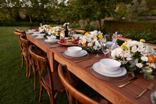 crockery arranged with flowers on table for dinner - garden decoration stock pictures, royalty-free photos & images