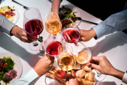 cropped hands of executives toasting wineglasses - food stock pictures, royalty-free photos & images