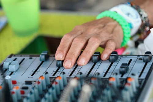 cropped hands senior woman working with sound mixer and doing dj set for outdoor summer party - concert stock pictures, royalty-free photos & images