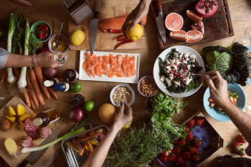 cropped image of hands preparing food on table - food stock pictures, royalty-free photos & images