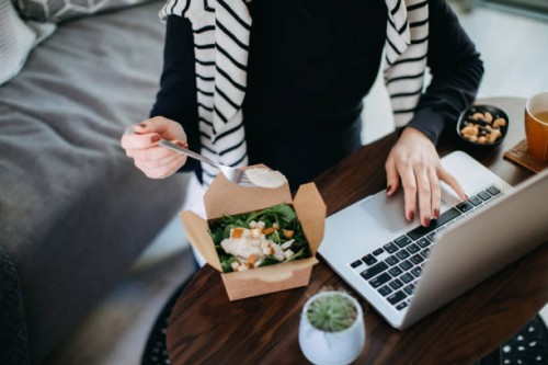 cropped shot of young asian woman eating takeaway meal, a fresh and healthy grilled chicken vegetable salad lunch box while working from home during lunch - junk food stock pictures, royalty-free photos & images