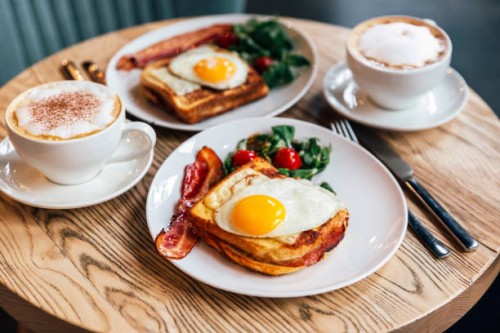 croque madame sandwich with bacon served for breakfast in a restaurant, side view - food stock pictures, royalty-free photos & images