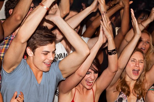 crowd cheering in front of camera - concert stock pictures, royalty-free photos & images